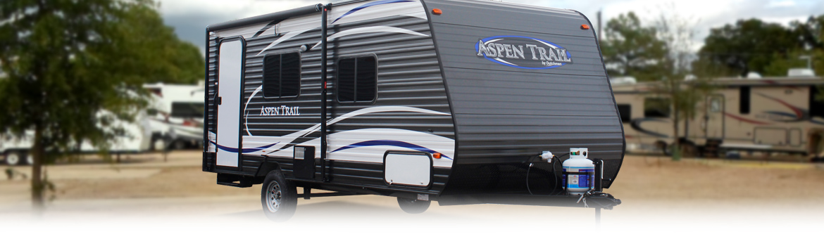 Aspen Trail travel trailer un-hitched in an RV park